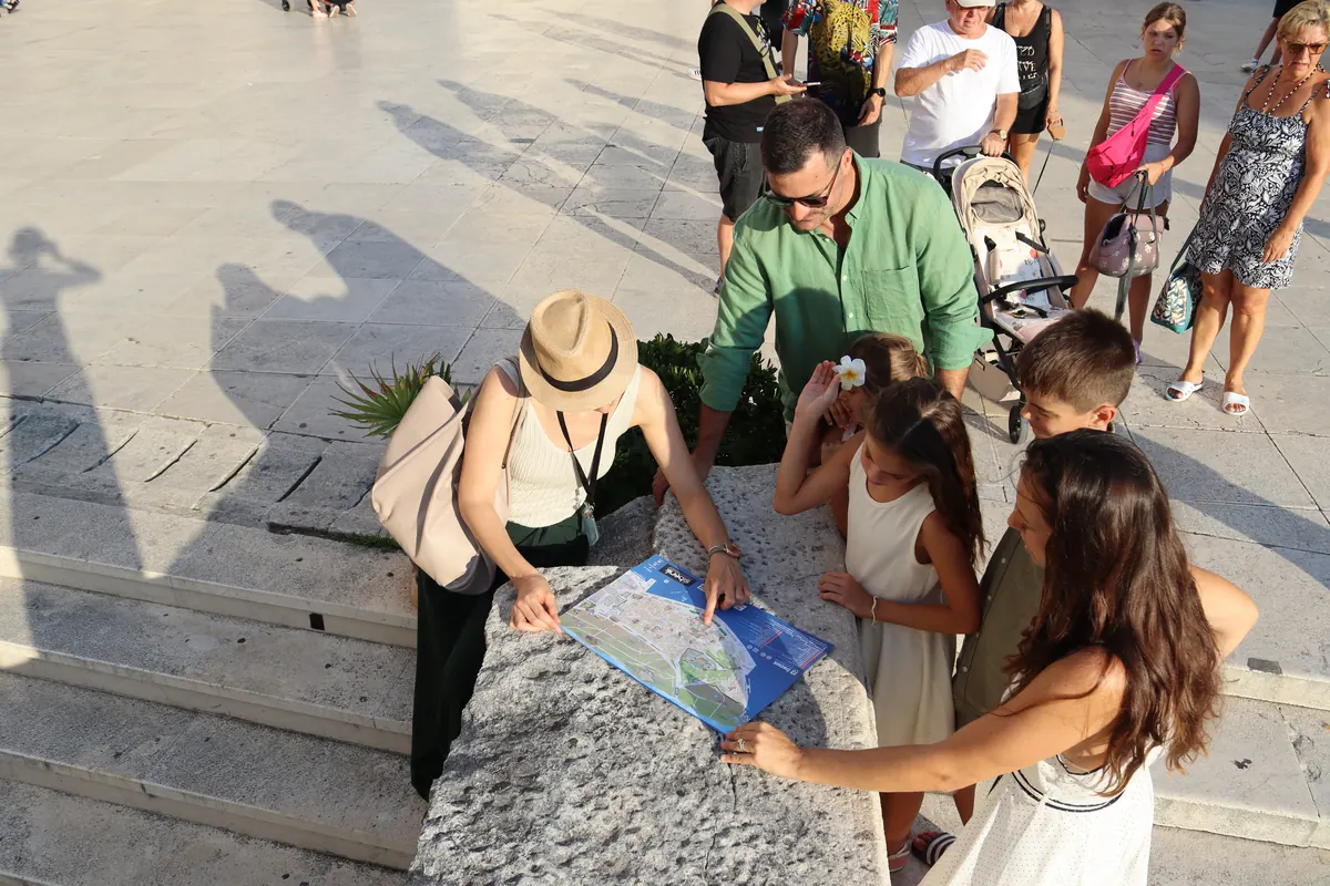 Guests planning their route with Ivana, a licensed tour guide in Šibenik