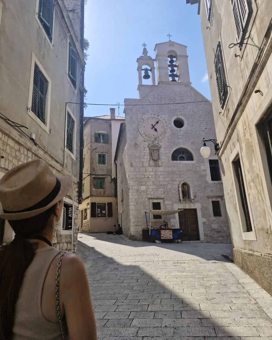 Walking toward a small stone church on the Šibenik history and coffee tour