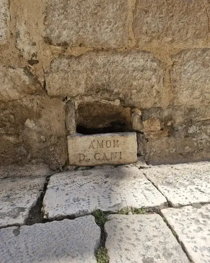 A small inscribed stone niche, one of the hidden details shown on the Šibenik history and coffee tour