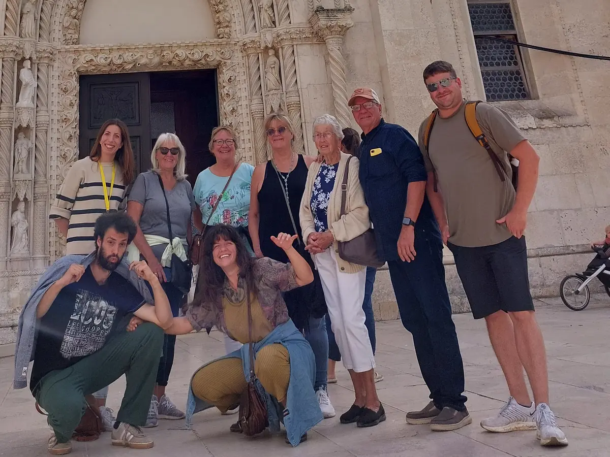 Ivana, licensed local guide, with a private tour group in front of the Cathedral of St. James in Šibenik