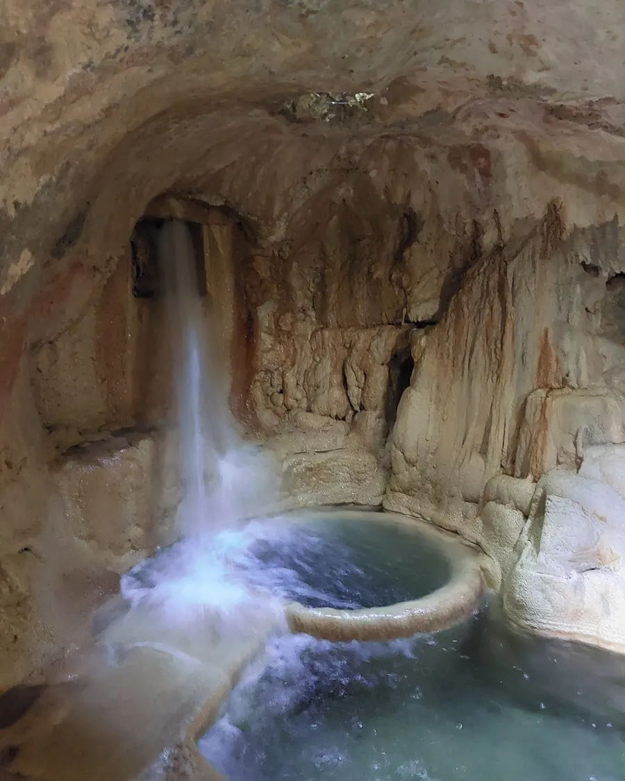 A travertine grotto waterfall seen on the Krka private walking tour