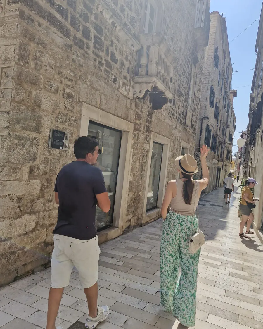 Ivana leading guests through the stone streets on an Old Town walking tour of Šibenik