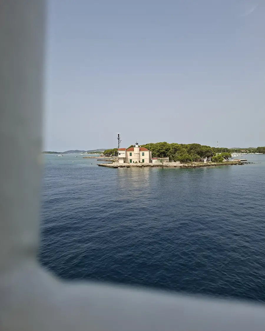 A lighthouse on a small islet passed on the boat ride to Zlarin